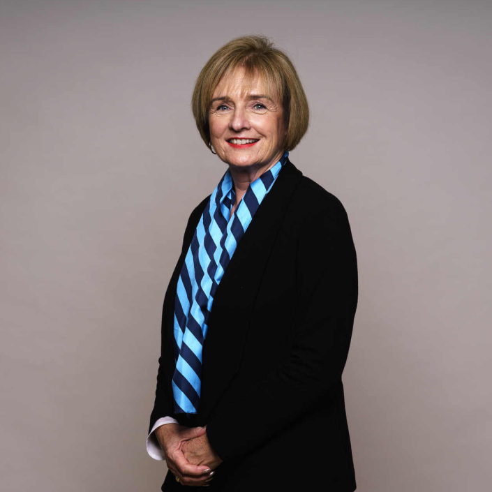 Corporate Photography Woman posing for her corporate portrait Photo wearing a blue scarf