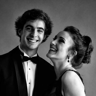 Man and woman smiling at their School Ball photo
