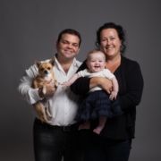 Man woman their child and a dog