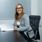 Business woman sitting by her office desk