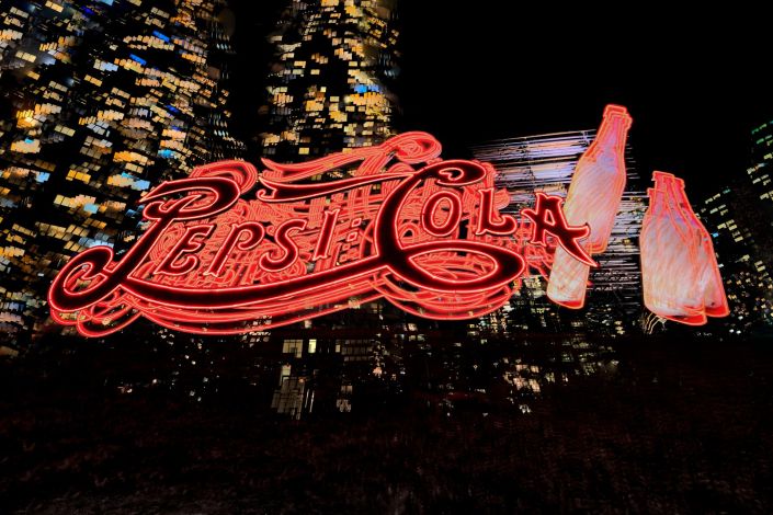 Commercial Photos Pepsi Cola red neon sign at night in New York City